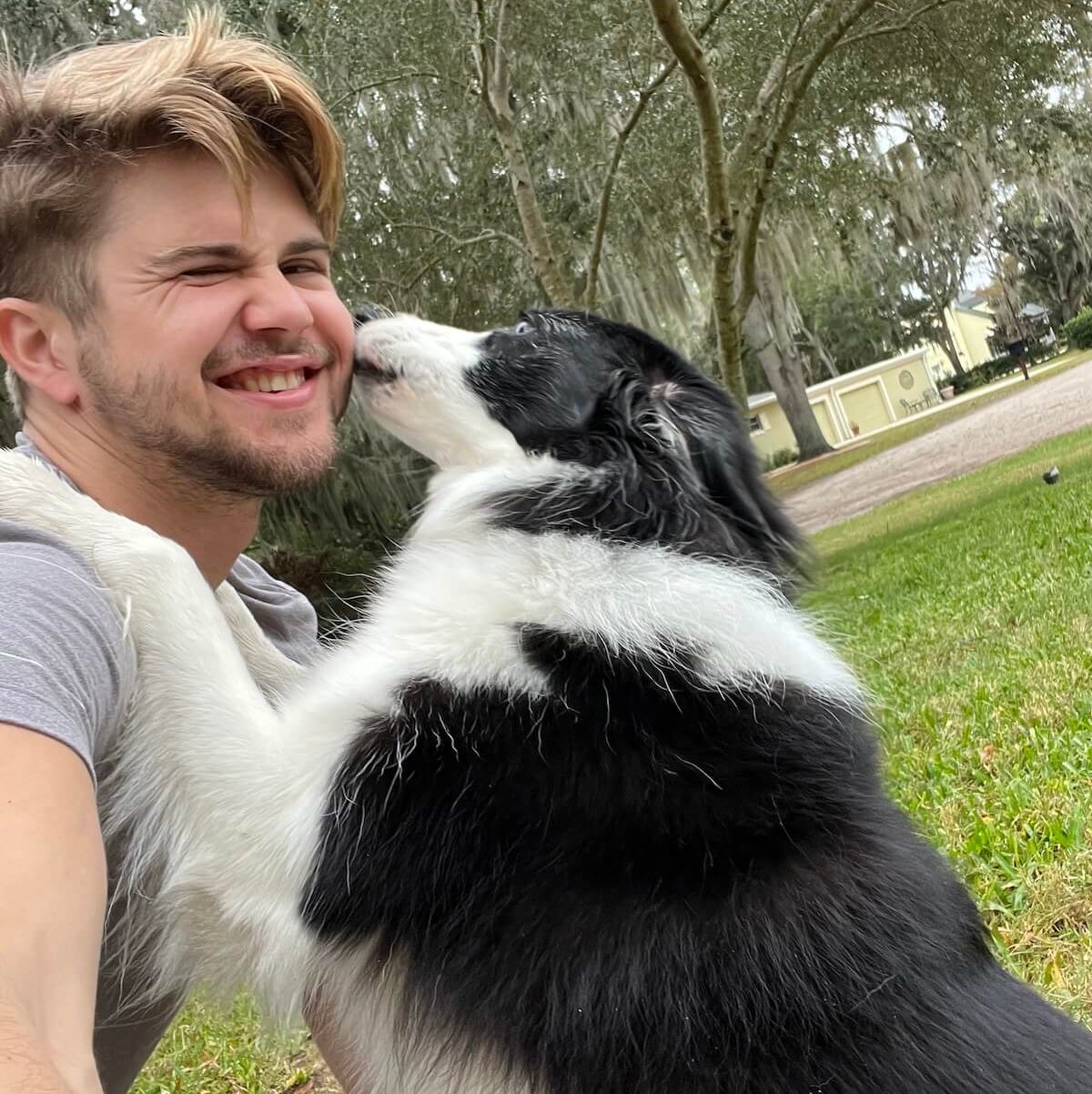evan and a border collie at the park evan and a border collie at the park